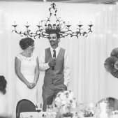 Bride & Groom in Front of Pipe & Drape BW; Photo Credit: Brandon Werth Photography